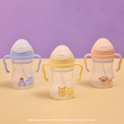 Three b.box winnie the Pooh sippy cups on a purple and beige background