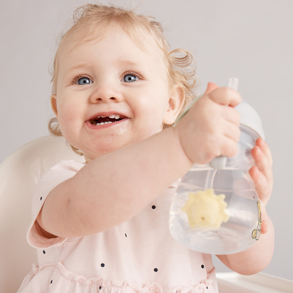 child with b.box for kids: winnie the pooh sippy cup