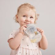 child with b.box for kids: winnie the pooh sippy cup