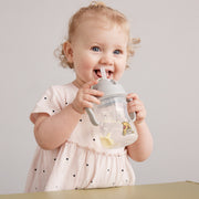 child with b.box for kids: winnie the pooh sippy cup