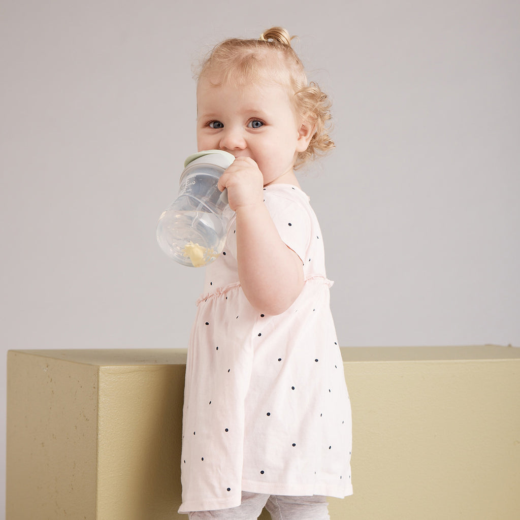 child with b.box for kids: winnie the pooh sippy cup