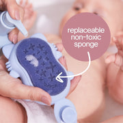 Hand pumping b.box body Cleanse Hair+ Body Wash on the Silicone Baby Bath Brush's Replaceable Non-Toxic Sponge