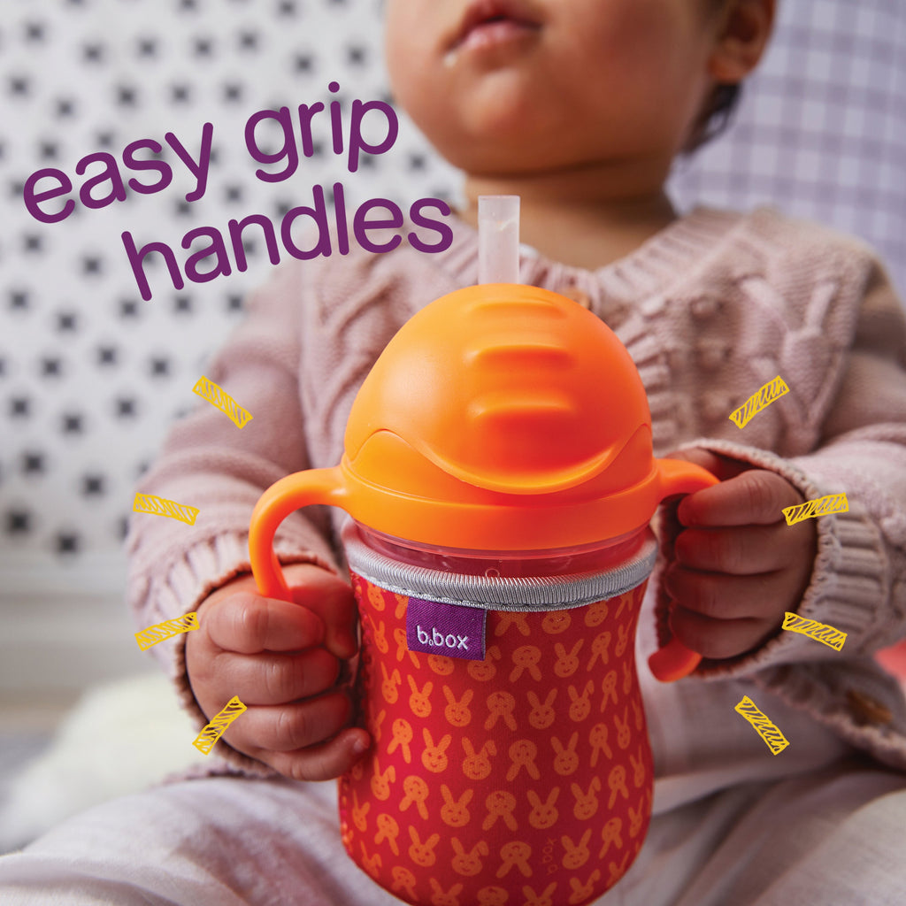 child with sippy cup - orange zing - b.box for kids